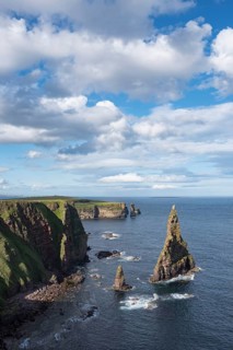 Rugged coastal landscape with the rock spikes Duncansby Stacks