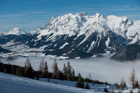View from the Hauser Kaibling ski mountain to the Dachstein massif with the Enns valley in the fog