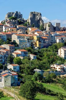 View of mountain village Pietrabbondante with medieval tower at the rock Morg Caraceni
