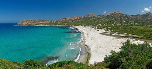 Turquoise-blue water on the sandy beach of Ostriconi