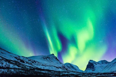 Northern Lights (Aurora borealis) over mountains