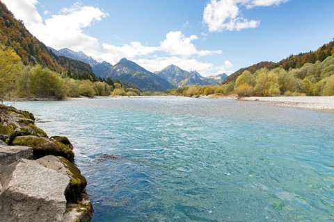 The river Lech with autumnal forest near the Ziegelwiesen