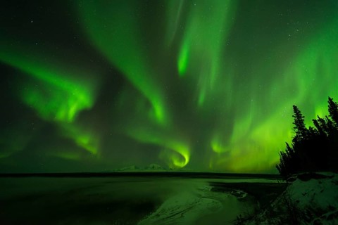 Aurora over the Copper River and the distant peaks of Wrangell Mountains