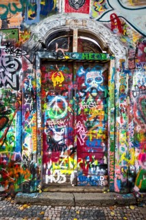 Brightly painted door with graffiti