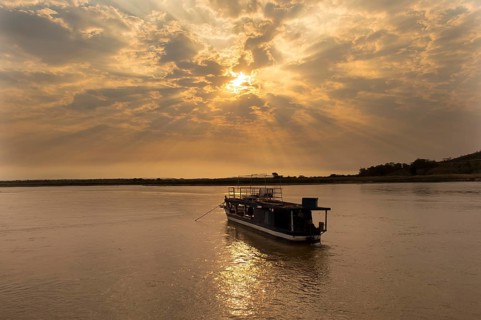 Boat on the Tsiribihina River at sunrise