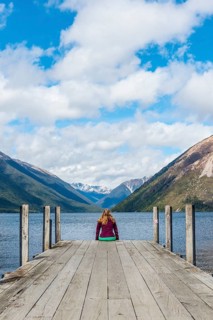Woman sitting on dock
