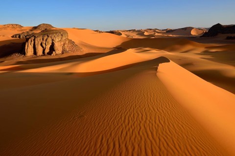 Sanddunes and rock towers at Moul Naga