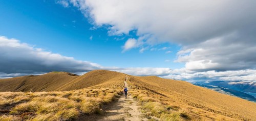 Female hiker on hiking trail to Isthmus Peak
