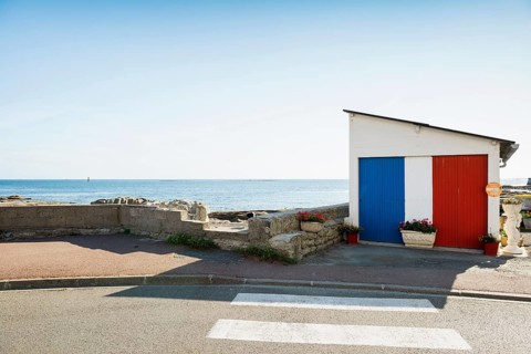 Garage by the sea painted in French national colours