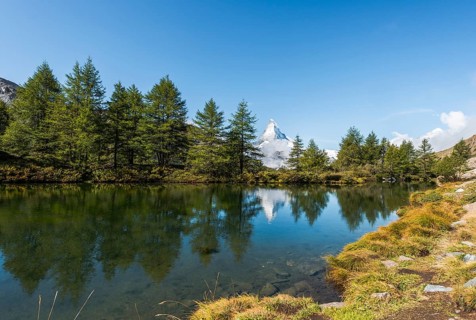 Snow-covered Matterhorn reflected in the lake