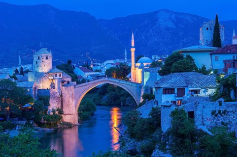 Mostar Bridge over Neretva river at sunset