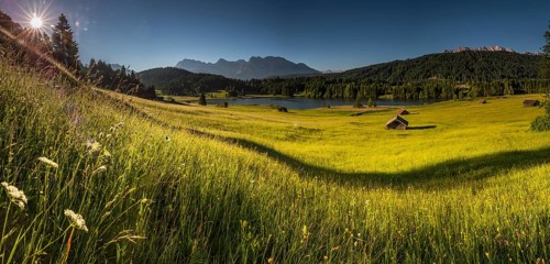 Small cabins on mountain meadow