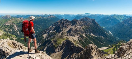 Hiker views of mountains and Alps