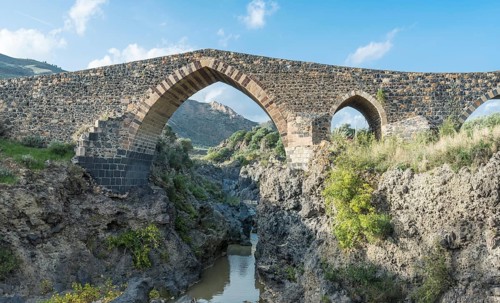 Medieval Saracens bridge crossing the river Simeto