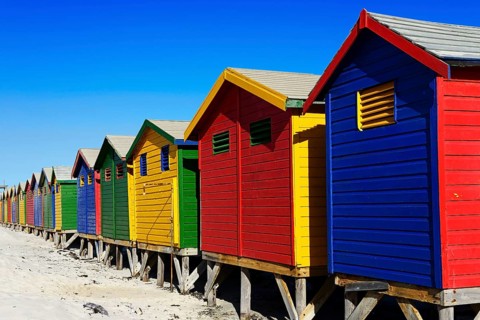 Colorful beach cottages on the sandy beach