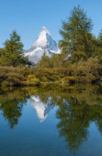 Snow-covered Matterhorn reflected in the lake