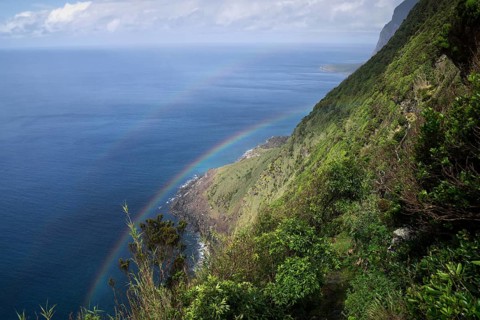 Steep coast with rainbow at Faja de Lopo Vaz