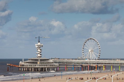 Pier with bungee jumping tower and Ferris wheel
