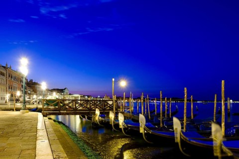 Gondolas at the quay of Riva degli Schiavoni at dusk