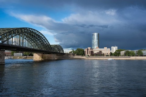 Hohenzollern bridge with the Hotel Hyatt Regency and the high-rise office building Kolntriangle Cologne