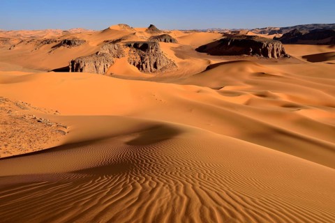 Sanddunes and rock towers at Moul Naga