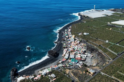 La Bombilla with black lava beach and lighthouse