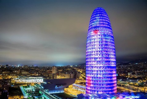 City view with illuminated Agbar Tower at night