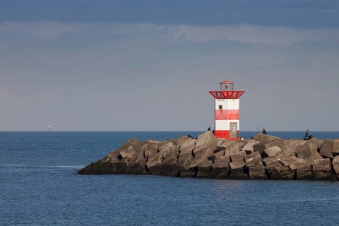 Small lighthouse at harbor entrance