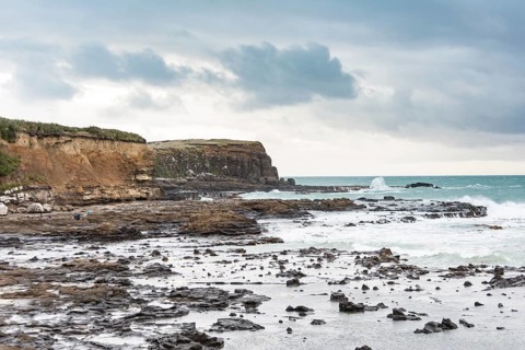 Cliffs and foaming waves