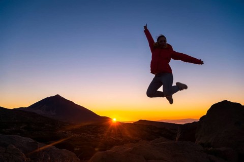 Young woman jumping in the air