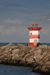 Small lighthouse at harbor entrance