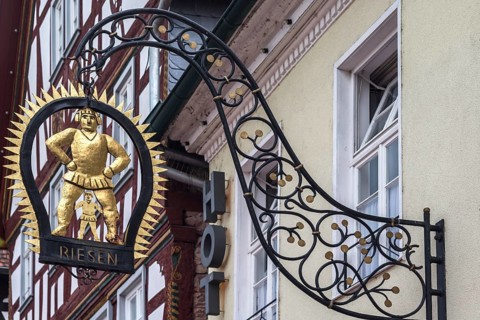 Hanging shop sign of the Gasthof Zum Riesen