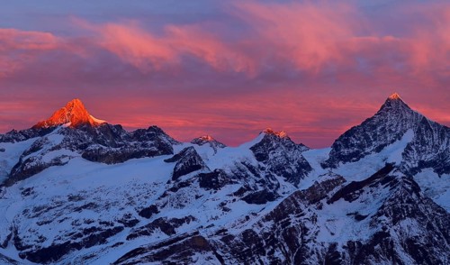Zinalrothorn with snow in red dawn glow