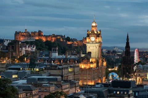 View of historic centre of Edinburgh with Balmoral Hotel tower and Edinburgh Castle