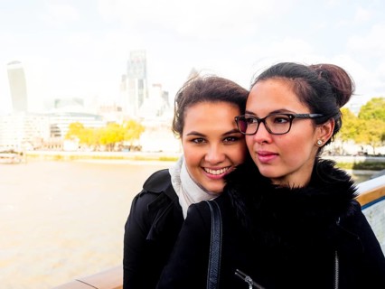 Two young women on a bridge