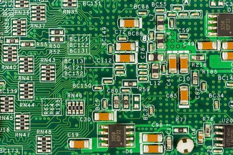 Green circuit board with conductive tracks and elements