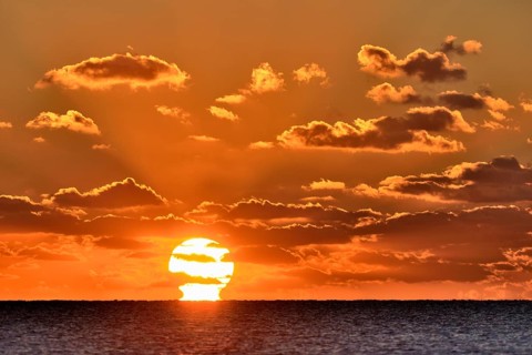 Sunset with cloudy sky above the North Sea
