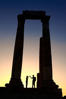 Couple forms a heart in sunset at the Temple of Hercules at the Citadel