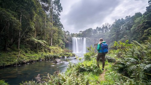 Hiker faces waterfall