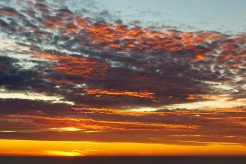 Shining sky over the Pacific Ocean at sunset