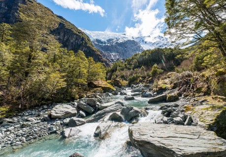 Glacial river flowing through mountains