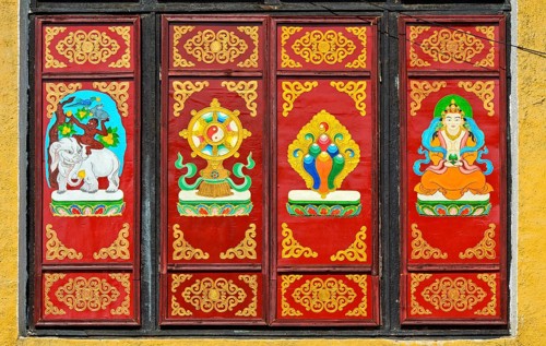 Traditional Buddhist motifs on wall