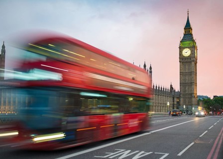 Red double-decker bus on the Westminster Bridge