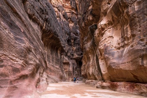 The narrow canyon Siq leads to Petra