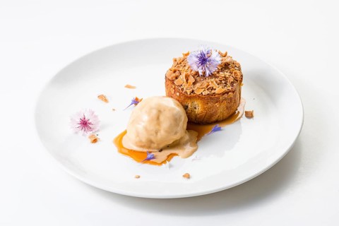 Apple and caramel pudding with a ball of ice cream