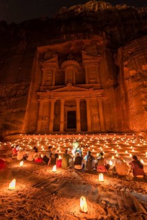 People sitting in front of candles