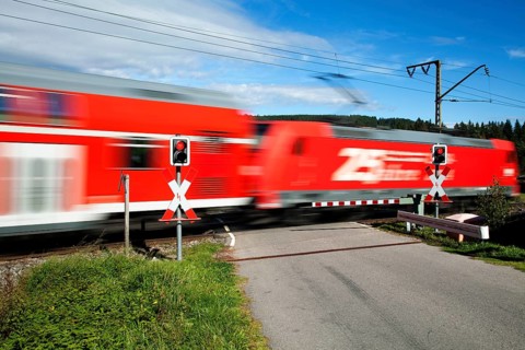 Level crossing with passing train