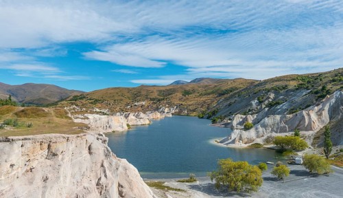 Lake surrounded by limestone cliffs