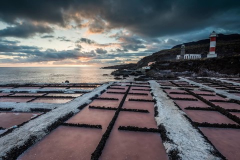Salinas of Fuencaliente with lighthouse Faro de Fuencaliente at sunset