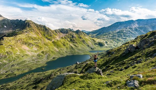 Hiker stretching arms in the air